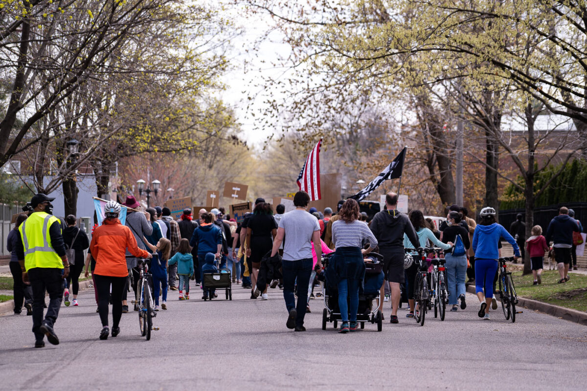 Protesters gather outside the residence of Governor Tim Walz to protest the treatment of protesters over the last week.