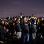 Protesters with hands up in Brooklyn Center 1 The community protests outside the Brooklyn Center Police Department after the death of 20-year old Daunte Wright. Wright was shot and killed by Brooklyn Center Police officer Kim Potter during a traffic stop on April 11th.