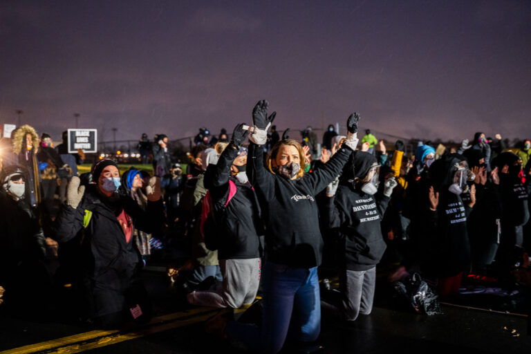 Protesters with hands up in Brooklyn Center 1 The community protests outside the Brooklyn Center Police Department after the death of 20-year old Daunte Wright. Wright was shot and killed by Brooklyn Center Police officer Kim Potter during a traffic stop on April 11th.