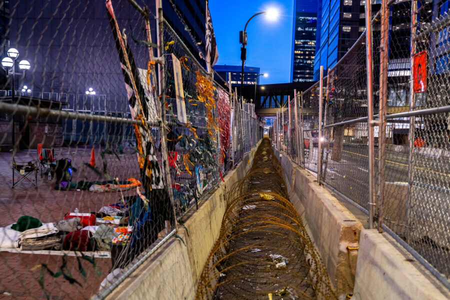 Minneapolis Government Center: Razor wire and protest signs