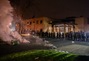 Riot police surrounded the Brooklyn Center police department after one of it's officers shoot and kill Daunte Wright earlier in the day.