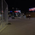 FOX9 billboards in downtown Minneapolis. US Bank Stadium to the left behind security fencing.