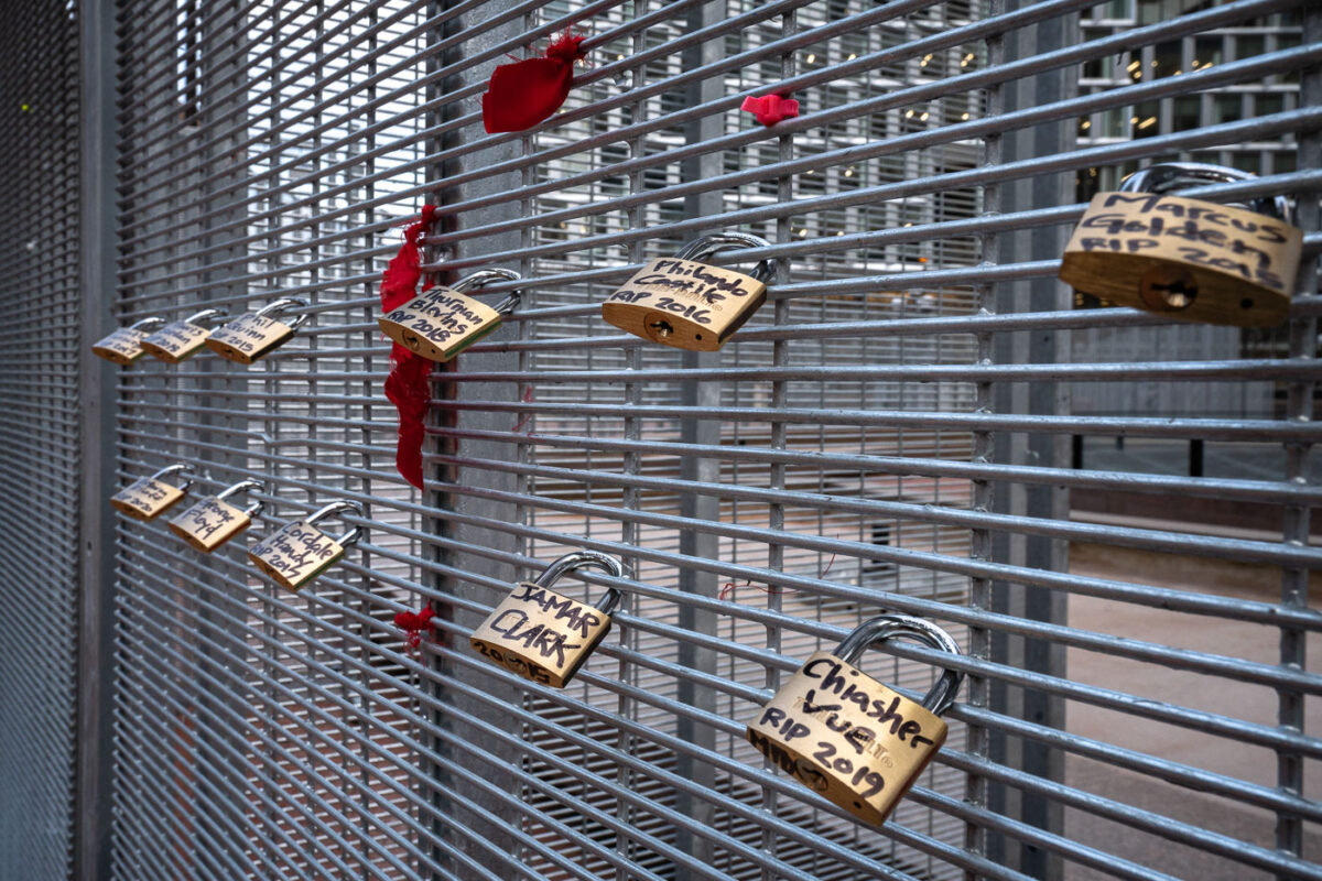 Locks with the names of police brutality victims placed on the fencing around the Hennepin County Government Center during the Derek Chauvin murder trial.