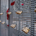 Locks with the names of police brutality victims placed on the fencing around the Hennepin County Government Center during the Derek Chauvin murder trial.