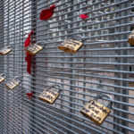 Locks with the names of police brutality victims placed on the fencing around the Hennepin County Government Center during the Derek Chauvin murder trial.