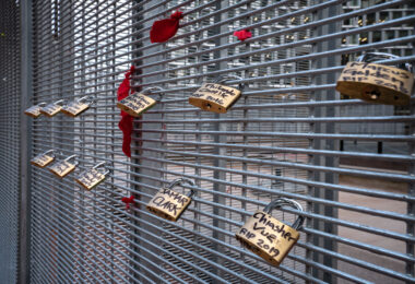 Locks with the names of police brutality victims placed on the fencing around the Hennepin County Government Center during the Derek Chauvin murder trial.