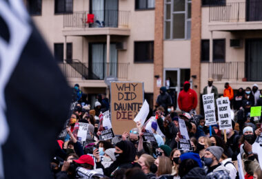 Protesters outside the Brooklyn Center Police Department, where residential apartments are directly across the street.
