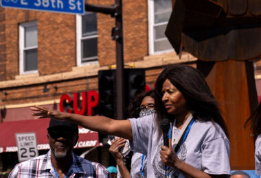 George Floyd’s aunt Angela Harrelson speaks to the crowd at George Floyd Square on the 1-year anniversary of his murder.