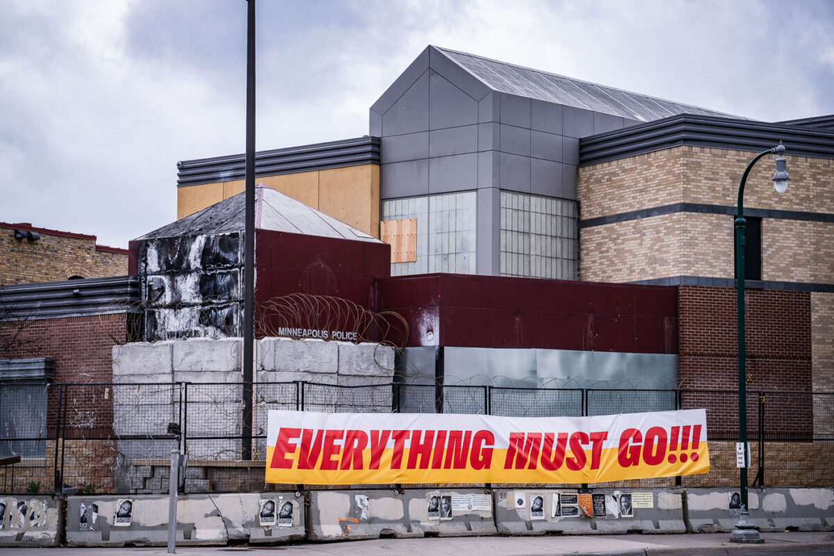 "Everything must go!!!" on the fencing of the burned Minneapolis police third precinct police station.