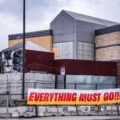 "Everything must go!!!" on the fencing of the burned Minneapolis police third precinct police station.