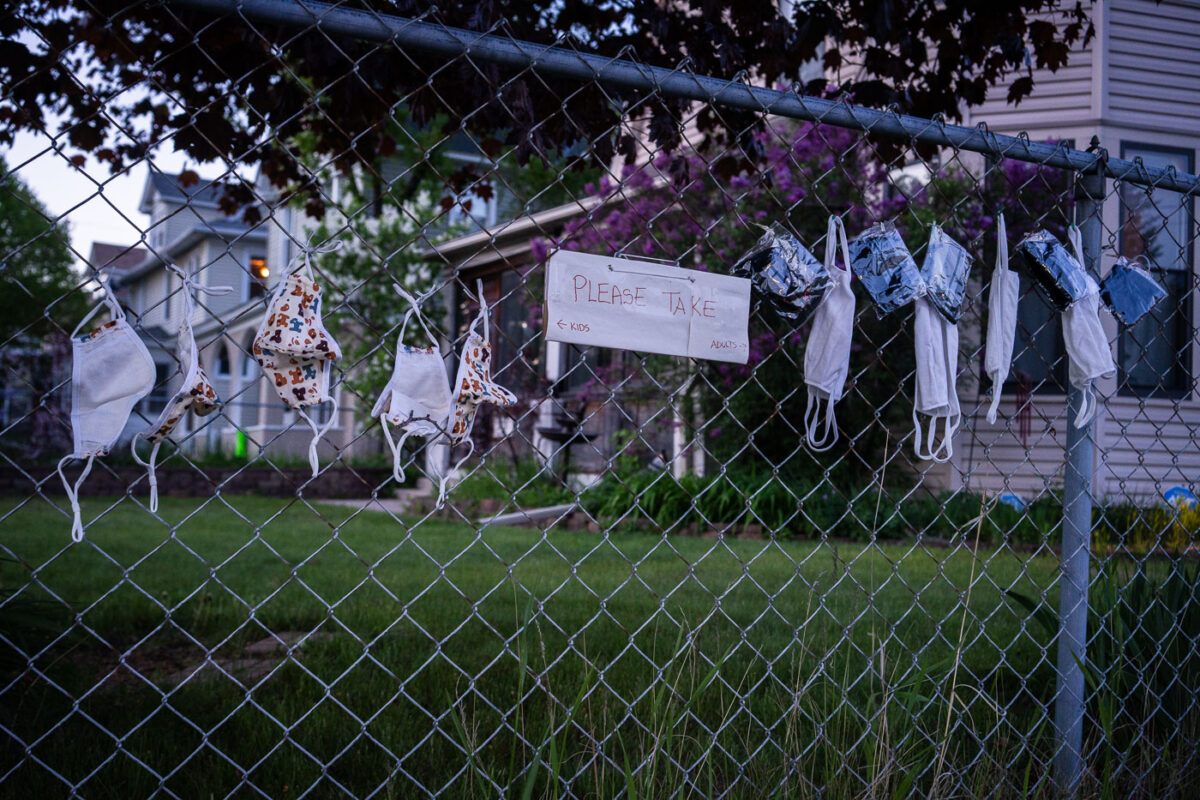 Free face masks on a fence in South Minneapolis.