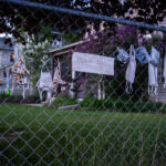 Free face masks on a fence in South Minneapolis.