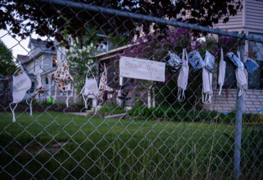 Free face masks on a fence in South Minneapolis.