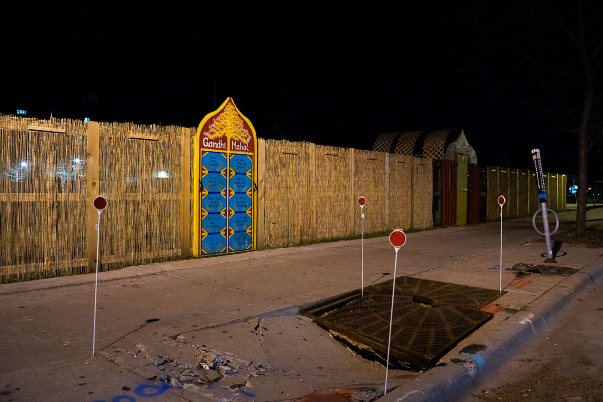 Straw fencing around the former Gandhi Mahal building in South Minneapolis.