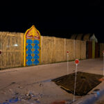 Straw fencing around the former Gandhi Mahal building in South Minneapolis.