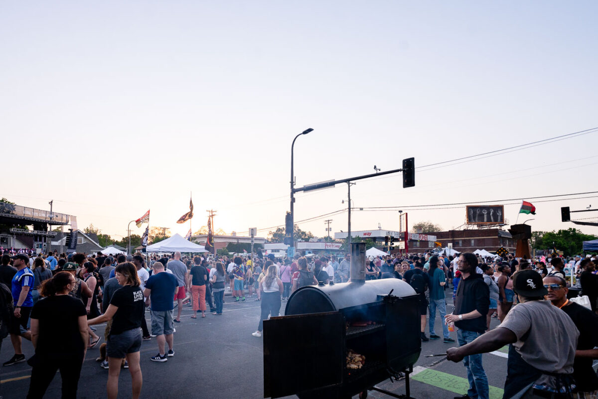 Food being grilled at Rise and Remember 2021 at George Floyd Square. The event is held on the anniversary of George Floyd's murder at George Floyd Square in Minneapolis.