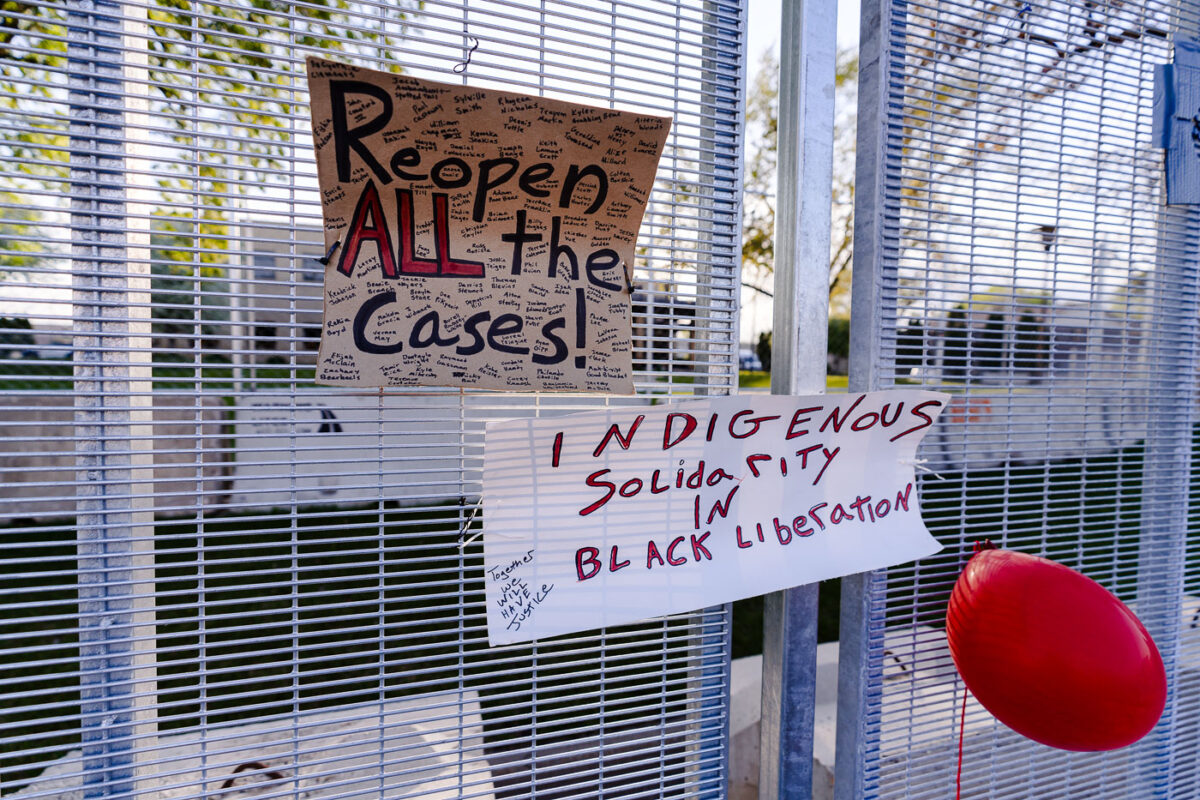 Signs attached to security fencing outside the Brooklyn Center Police Department following the death of Daunte Wright.