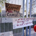 Signs attached to security fencing outside the Brooklyn Center Police Department following the death of Daunte Wright.