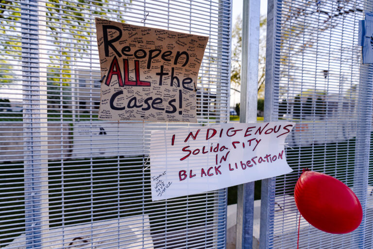 Indigenous Solidarity In Black Liberation protest sign 1 Signs attached to security fencing outside the Brooklyn Center Police Department following the death of Daunte Wright.