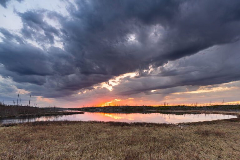 Island River Sunset, Superior National Forest 1 Island River at sunset in Superior National Forest, with storm clouds over reflected water.
