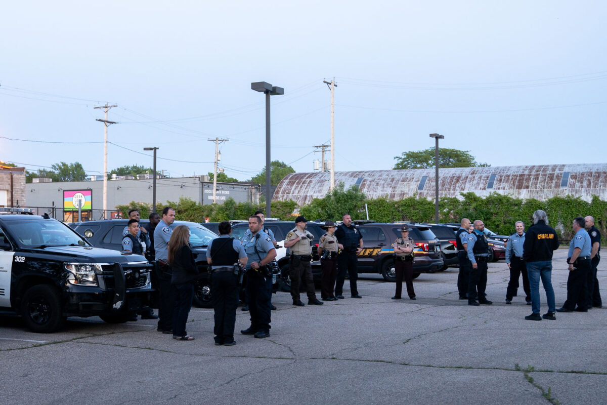 Police officers gather at the Third Precinct on the 1 year anniversary of the burning of the precinct. The Minneapolis Police announced over the radio the precinct had been compromised at 10:14pm on May 28th, 2020.