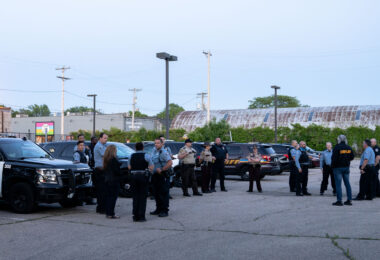 Police officers gather at the Third Precinct on the 1 year anniversary of the burning of the precinct. The Minneapolis Police announced over the radio the precinct had been compromised at 10:14pm on May 28th, 2020.