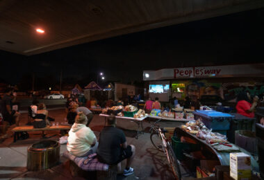 The community gathers to watch a screening of the movie "Mayor" at The People's Way at George Floyd Square.