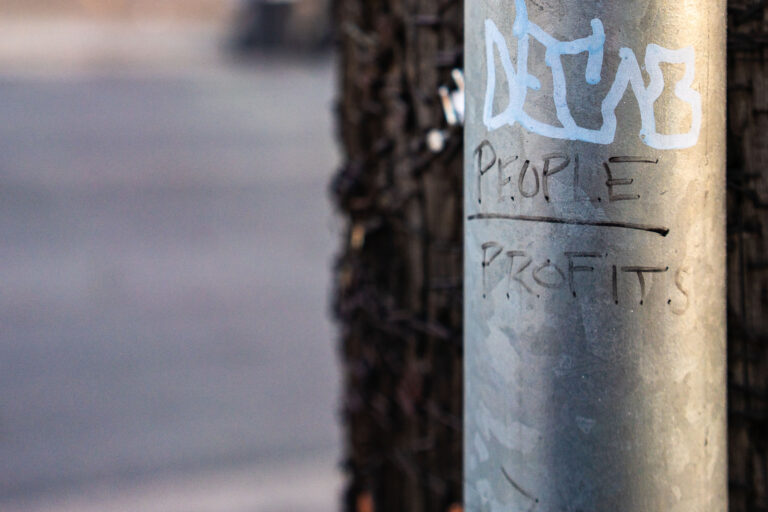 People over profit graffiti in Minneapolis 4 People over profit graffiti on Minneapolis pole