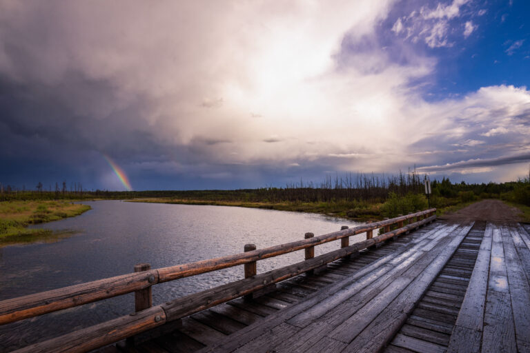 Rainbow near Isabella Lake, Superior National Forest 1 Rainbow over Isabella Lake in Superior National Forest, Minnesota, beside a wooden bridge.