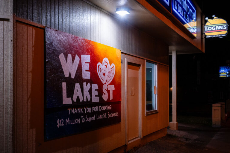 We Love Lake Street sign at the Laundromat 2 A board thanking the public for donating to rebuild efforts.