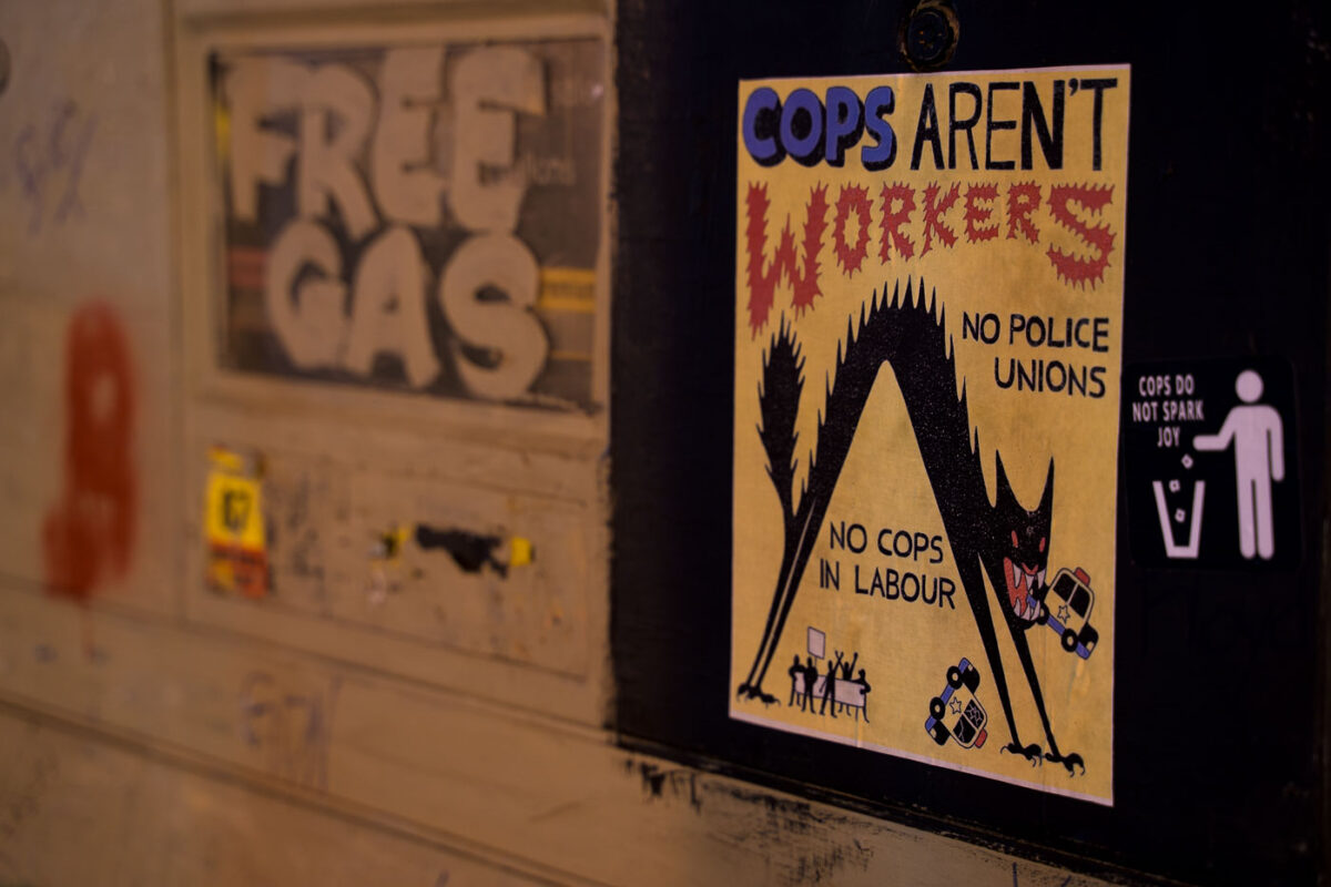 Protest signs attached to a gas pump at the former Speedway gas in George Floyd Square.