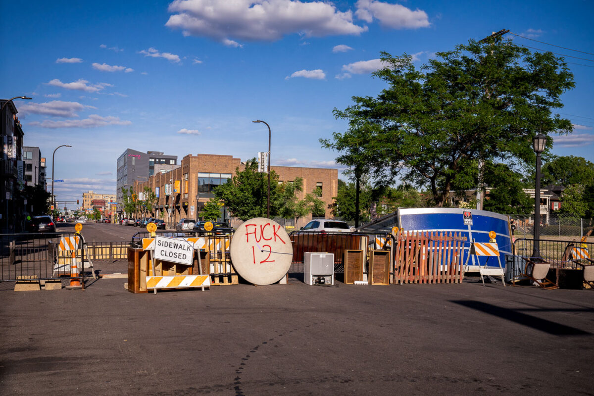 Barricades on Lake Street near the Deona Marie and Winston Smith memorials.

Winston Smith was killed by law enforcement on June 3rd and Deona Marie was killed on June 13th.

Marie was killed when Nicholas Kraus drove his vehicle into those protesting the killing of Smith.