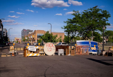 Barricades on Lake Street near the Deona Marie and Winston Smith memorials.

Winston Smith was killed by law enforcement on June 3rd and Deona Marie was killed on June 13th.

Marie was killed when Nicholas Kraus drove his vehicle into those protesting the killing of Smith.