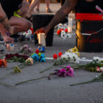 Candles being lit at a vigil for Winston Smith who was shot and killed by law enforcement on June 4th, 2021.The vigil was held at the top of the parking ramp where he was shot and killed the day earlier by a Federal task force.
