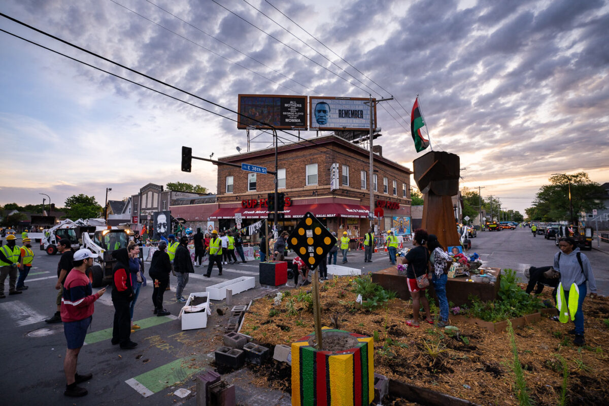 City employees move in to open George Floyd Square to vehicle traffic. The early morning activity took place almost a year after the area was closed after the murder of George Floyd.