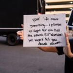 A protester holds up what he says was a sign Deona Marie made while protesting the Winston Smith killing.Deona Marie was killed on June 3rd when Nicholas Kraus drove his vehicle into those protesting the killing of Smith.Winston Smith was killed after Hennepin and Ramsey County officers fired their weapons while part of a Federal Task Force serving a warrant.