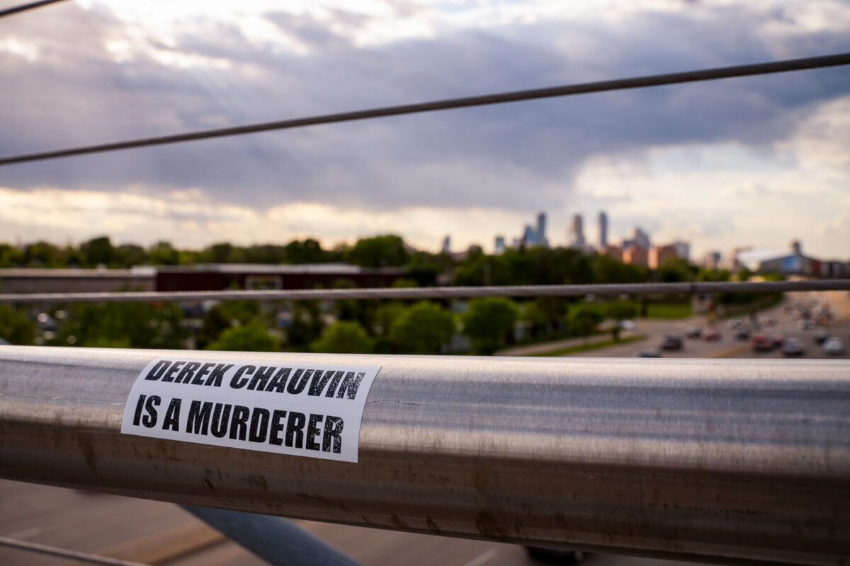 Sticker that reads "Derek Chauvin Is A Murderer" on the Martin Olav Sabo Bridge in Minneapolis.