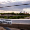 Sticker that reads "Derek Chauvin Is A Murderer" on the Martin Olav Sabo Bridge in Minneapolis.