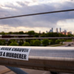 Sticker that reads "Derek Chauvin Is A Murderer" on the Martin Olav Sabo Bridge in Minneapolis.