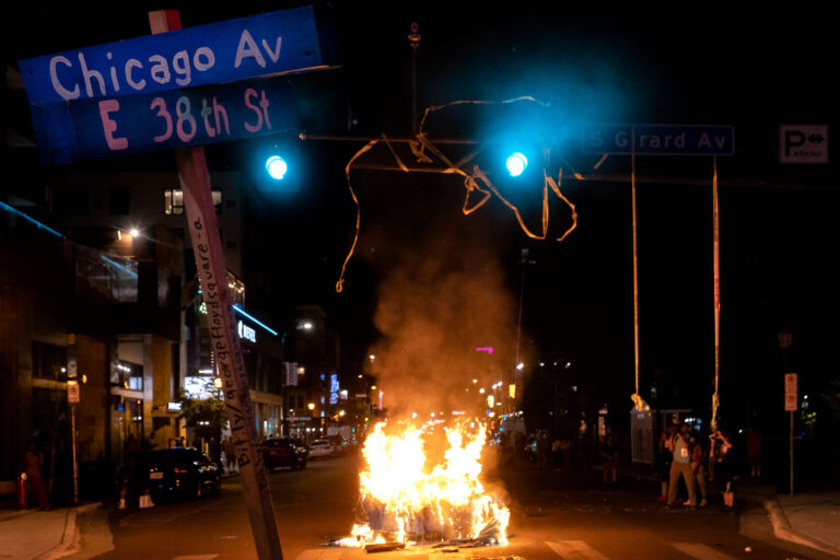 Dumpster fire in Minneapolis during WInston Smith protest 1 Protesters burn garbage cans in the evening after Winston Smith was killed by law enforcement in the nearby parking garage.