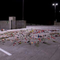 Roses and candles cover the ground where Winston Smith was killed by a Federal Task Force on June 3rd.