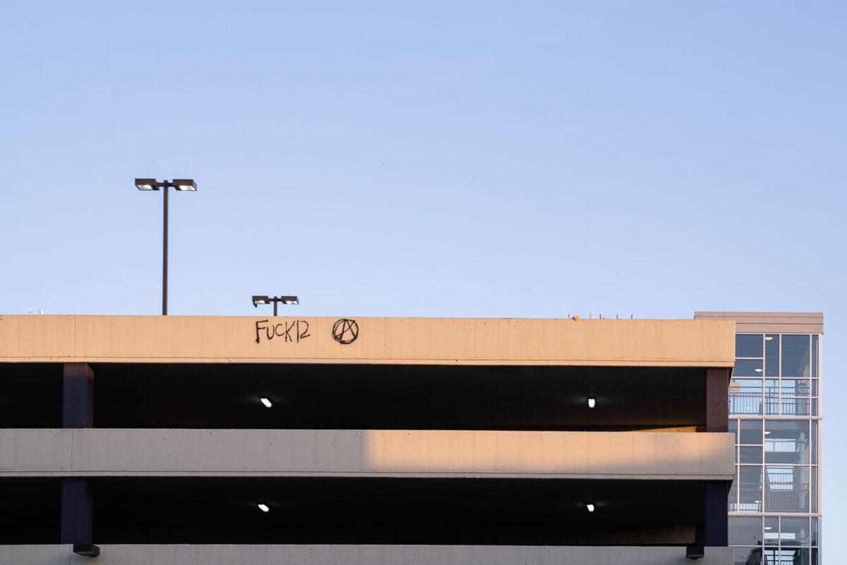 "Fuck 12" written on top of the Seven Points parking ramp. 

Winston Smith was killed on the top floor on June 3rd by a Federal Task Force.