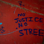 "No Justice No Street" written on a sidewalk outside "Wince Marie Way" The area in Uptown Minneapolis has been a place of protest since the June 3rd law enforcement killing of Winston Smith and the June 13th killing of Deona Marie.Marie was killed when Nicholas Kraus drove his vehicle into those protesting the killing of Smith.
