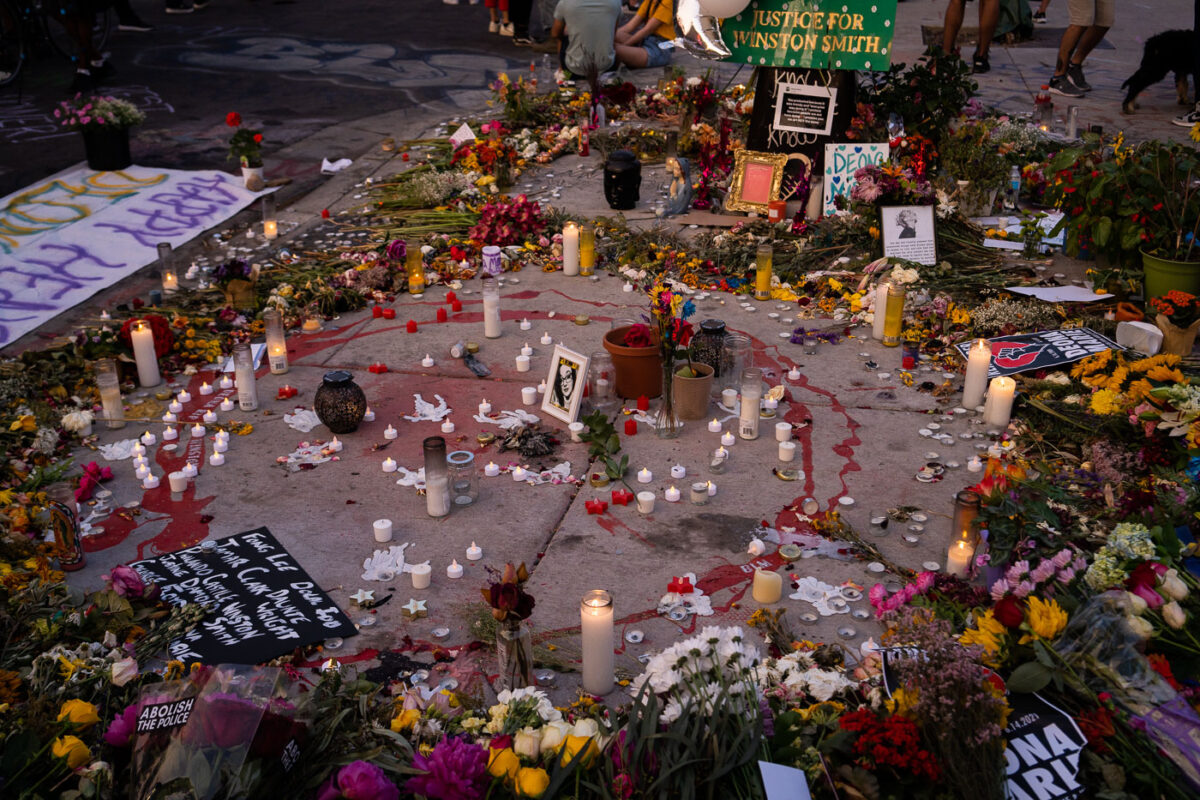 Candles and flowers around a large memorial for Deona Marie. Marie was killed on June 13th when Nicholas Kraus drove his vehicle into those protesting the killing of Winston Smith.

Winston Smith was shot and killed on June 3rd by a Federal Task Force.

Winston Smith was killed after Hennepin and Ramsey County officers fired their weapons while part of a Federal Task Force serving a warrant.