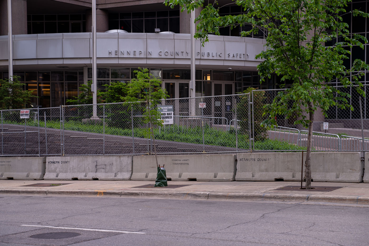 Hennepin County Jail with security fencing in June 2021