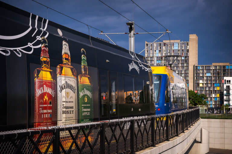 Jack Daniels wrap on a light rail train in Minneapolis 2 A Jack Daniel's wrapped light rail train in Minneapolis, Minnesota. Cedar Riverside apartments in the background.