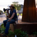 Jay Webb speaks at the garden in George Floyd Square while the city is opening the square to vehicle traffic.