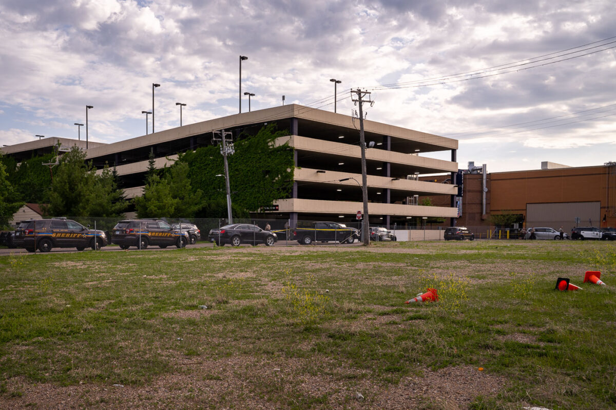 Police at the scene of the law enforcement shooting death of Winston Smith. Smith was killed by police hours earlier at the top of the parking structure.