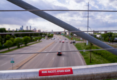 A sticker on the Martin Olav Sabo bridge in Minneapolis that reads "Make Racists Afraid Again".