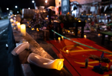 Plastic candles melting in the summer heat at the George Floyd Memorial at George Floyd Square.